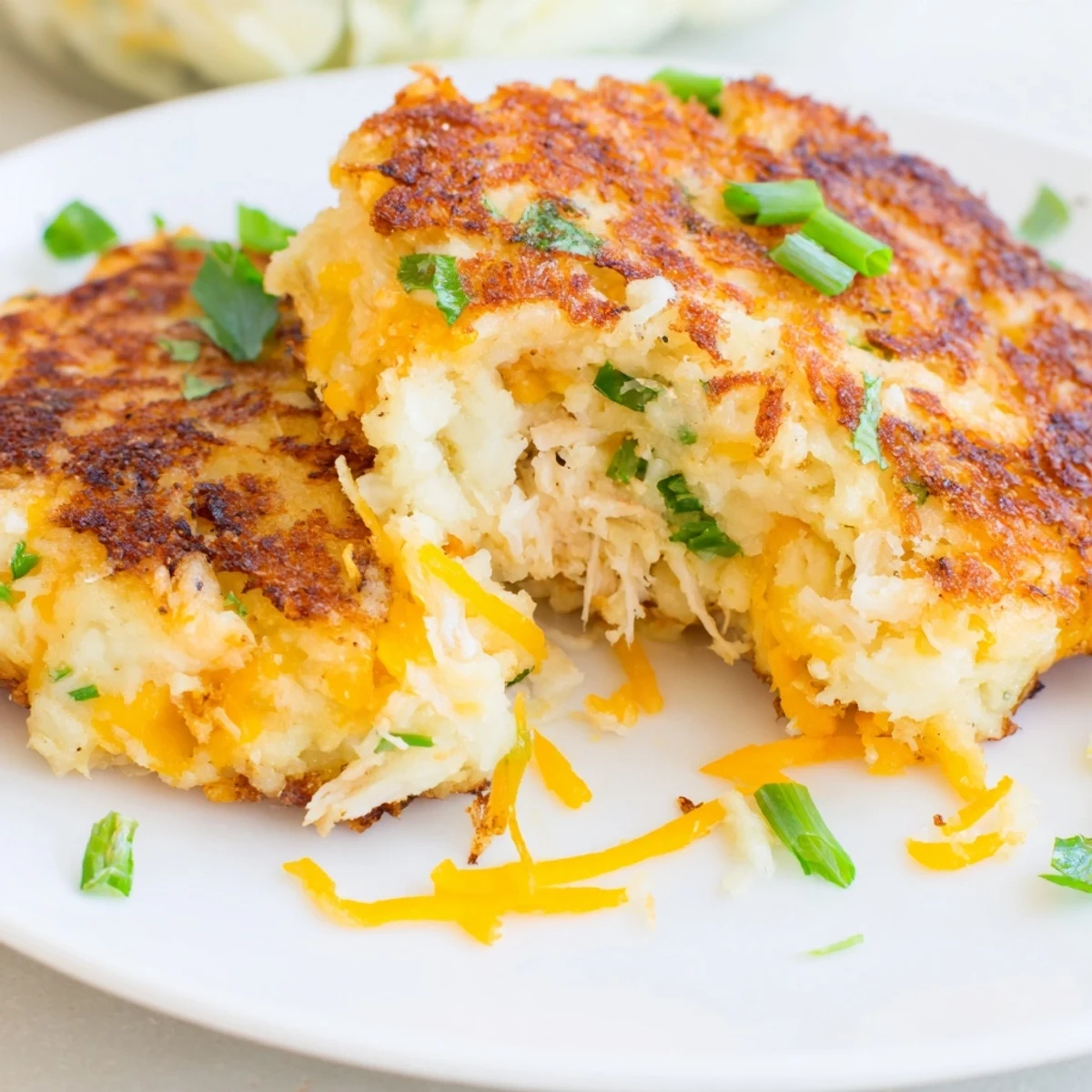 Hearty Potato and Chicken Cakes, featuring tender shredded chicken and creamy mashed potatoes, ready to savor.