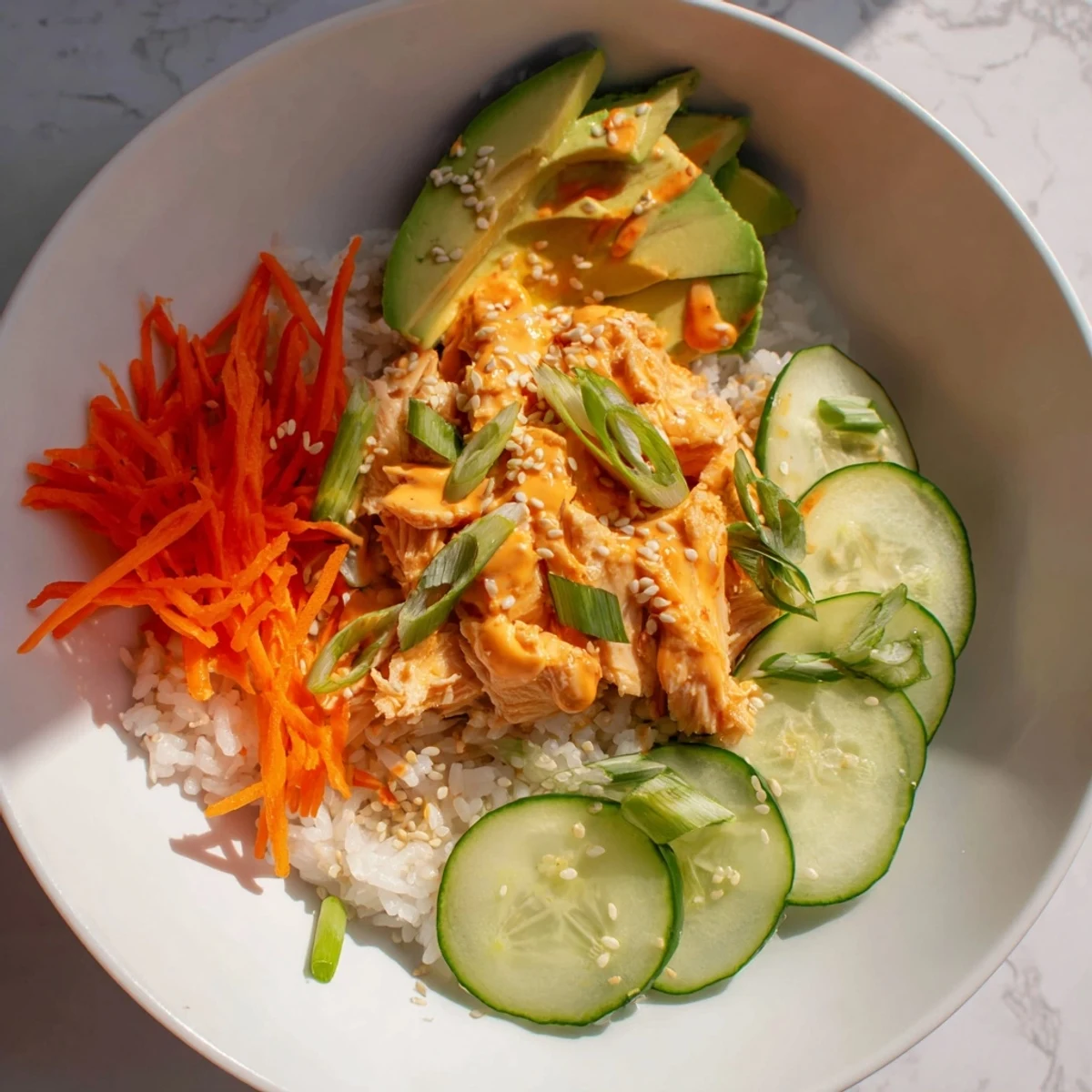 Spicy Canned Salmon Rice Bowl, a pescatarian delight with creamy sauce and Asian flavors.