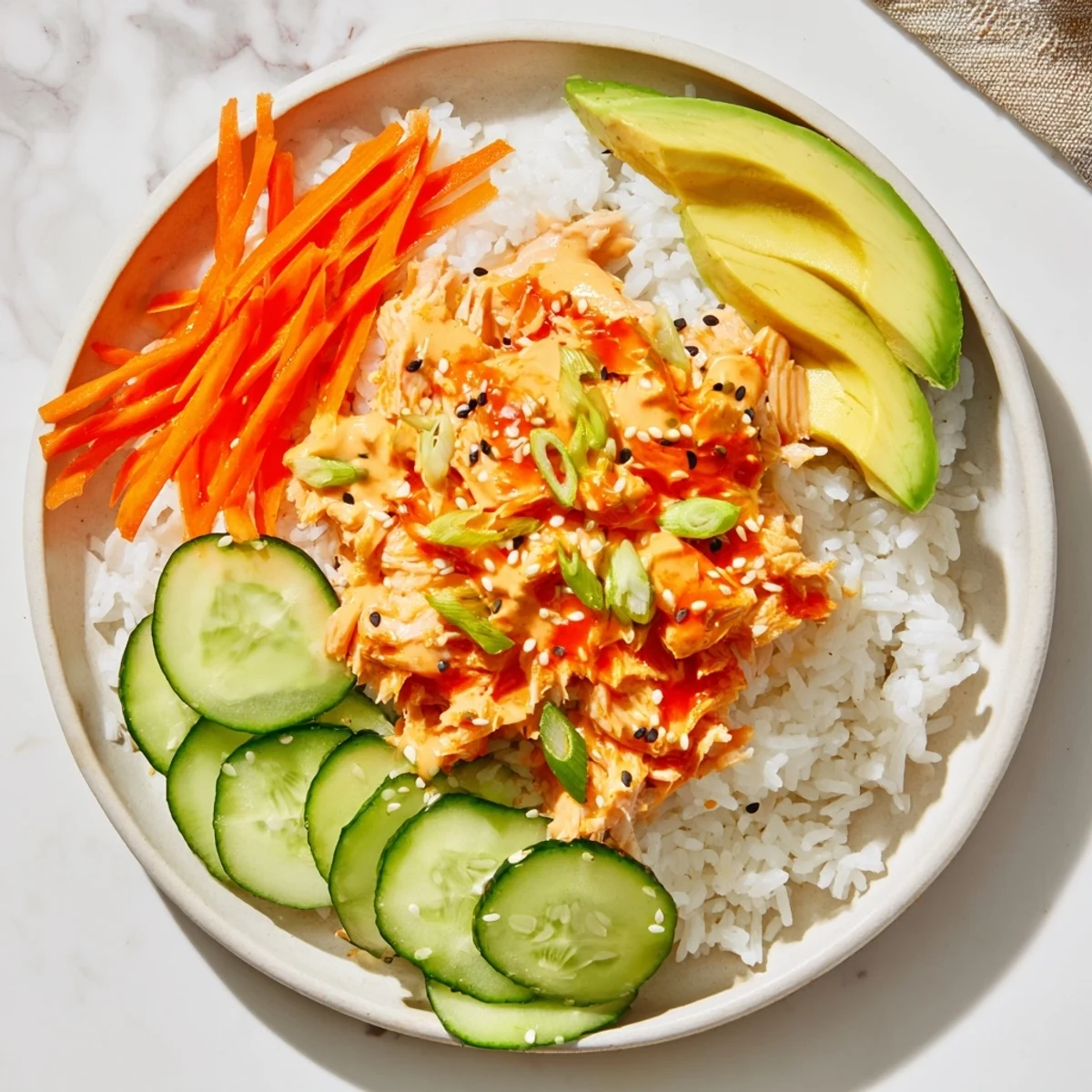 Spicy Canned Salmon Rice Bowl with colorful vegetables, a quick and delicious lunch idea.