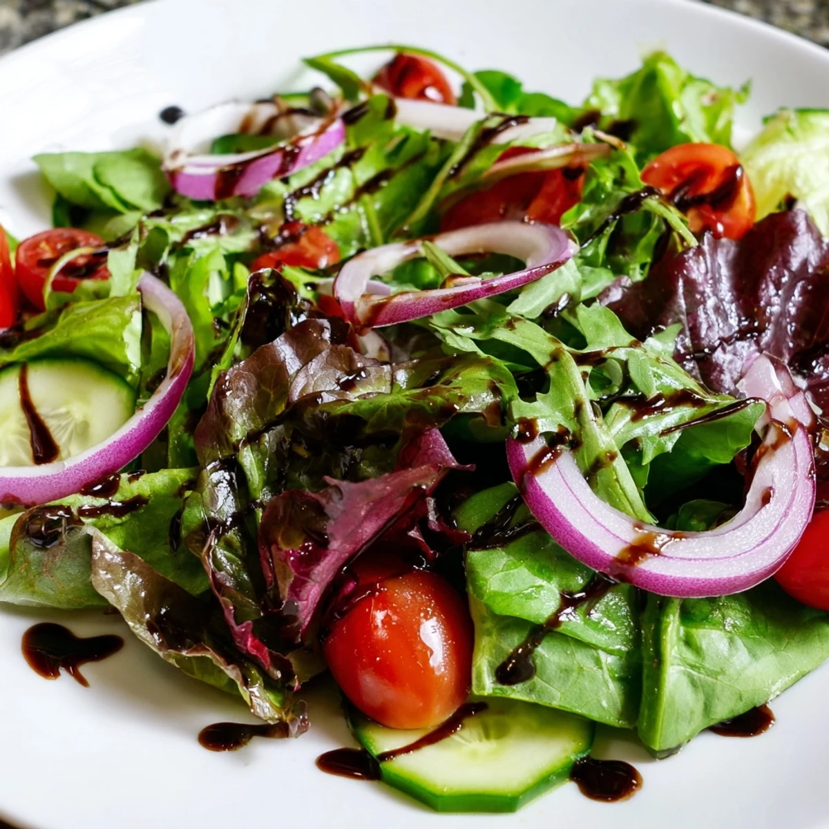Fresh, vibrant Quick Balsamic Vinegar Salad, showing mixed greens and colorful cherry tomatoes.