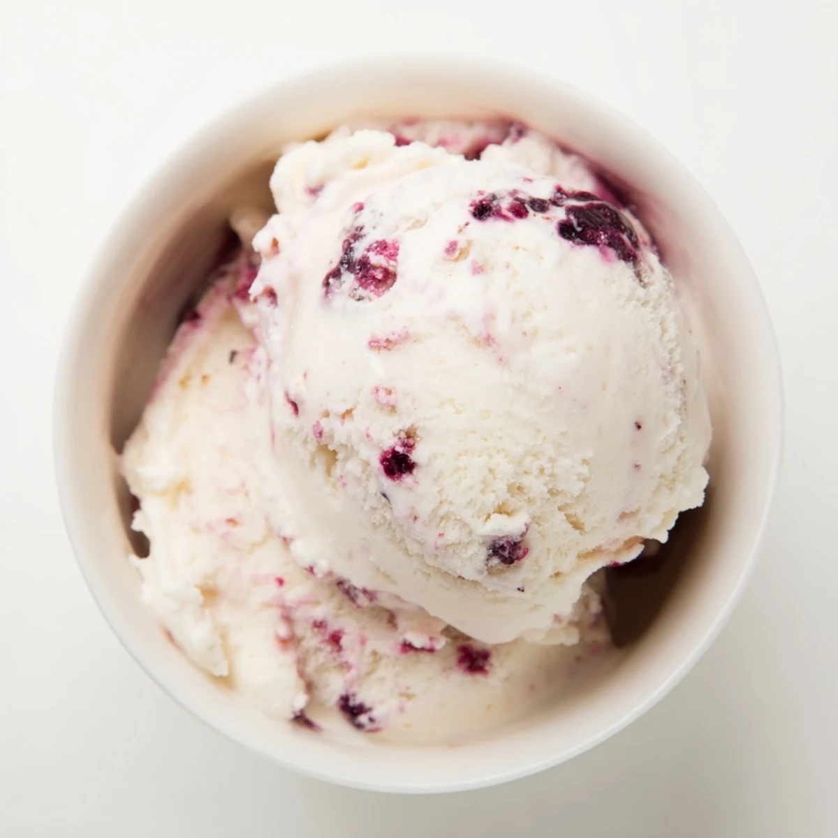 Refreshing cottage cheese ice cream with mixed berries, ready to serve in a bowl.