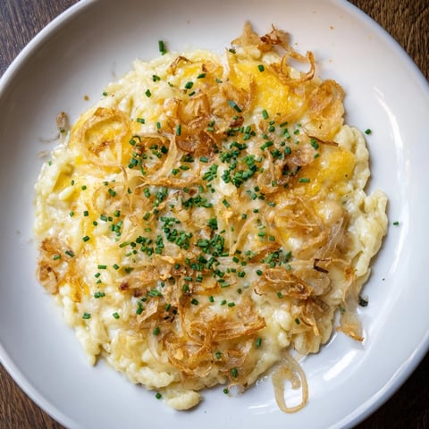 Golden, bubbling Cheesy Spaetzle Skillet, a vegetarian German main dish, ready to serve.