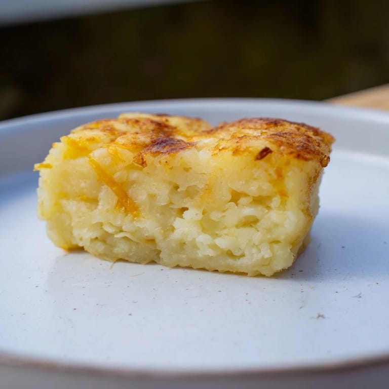 Savory The Secret 4-Ingredient Mashed Potato Cakes sizzling in the pan, a delicious way to use leftover mashed potatoes.
