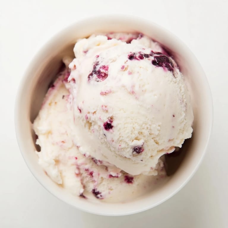 Refreshing cottage cheese ice cream with mixed berries, ready to serve in a bowl.